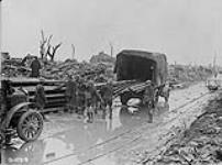 Unloading water mains in captured village on Arras front. April, 1917 Apri1, 1917.