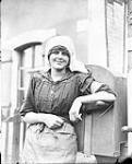 Yvonne, the railway crossing gate keeper just behind the Canadian lines. June, 1917 June, 1917.