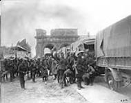 Canadians off to the firing line in lorries. West Gate, Arras. October, 1917 Oct., 1917.