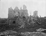 A ruined church where many Canadians and Boches rest in graves at the base of the ruins. December, 1917 Dec., 1917.
