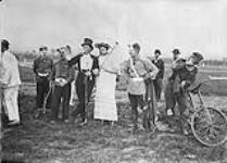 The Ring Master, wearing red coat, silk hat, etc. - Canadian Circus behind the Lines. May, 1918 MAY, 1918