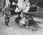 [Lieutenant A.T. Whealy supervising the arming of his Sopwith F.1 'Camel' aircraft of No. 203 Squadron, R.A.F., Allonville, France, July 1918.] July, 1918.