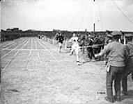 (Races) A Canadian Captain winning the 220 yards. Canadian Sports. June, 1918 June 1918.