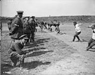 Duke of Connaught witnessing Tug of War. Canadian Corps Sports. July, 1918 July 1918.