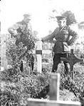 The A.D.P.S. [Assistant Director of Postal Services] at grave of Sergt. W. Britton. Advance East of Arras. September, 1918 Sep. 1918.