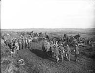 Prisoners and wounded passing 2nd Canadian Siege Bty. Advance East of Arras. October, 1918 Oct. 1918.