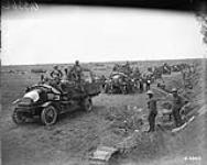 Canadian Motor Machine Gun Brigade waiting alongside Arras-Cambrai Road. Advance East of Arras. September, 1918 Sep., 1918.