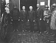 The first civilian on left acting in Valenciennes for the American and neutral countries' societies for feeding the civilians. November, 1918 Nov. 1918.