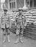 (British) Two men of an Imperial Battalion captured by the Germans after their escape to our lines, being interrogated by Canadian Corps Intelligence Officers, Neuville Vitasse. Sept. 1918 Sep., 1918.