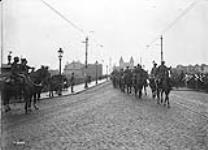 General Sir Arthur Currie takes the salute as the British Cavalry cross the Rhine at Bonn. December, 1918 Dec., 1918