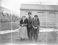 Man of Canadian Forestry Corps with old French couple. February, 1919 1914-1919