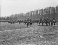 11th Inf. Brigade in review formation at Groenendael. 'Inspection of 4th Cdn Div by King Albert of Belgium.' March 1919 Mar. 1919