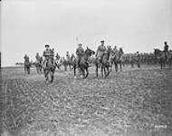 Passing along the lines of 10th Inf. Brigade at Overyssche.- 'Inspection of 4th Cdn Div. by King Albert of Belgium.' March 1919 Mar. 1919