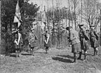 72nd Inf. Bn N.C.Os. photographing their newly presented colours. April 1919 Apr. 1919
