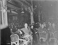 King Albert of Belgium, Gen Rawlinson 4th Army Commander and Gen. Currie with Georges Carpentier, watching 4th Canadian Division boxing tournament. Palais D'Eté, Brussels. March 1919 Mar. 1919
