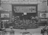Orchestra from the Canadian Cavalry Reserve Depot playing at Exhibition of Battle Pictures, Grafton Galleries, London, England Dec., 1916.