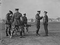 H.R.H. The Duke of Connaught inspecting Canadians and rewarding decorations. Seaford [between 1914-1919].