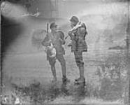 Two Canadians on leave from the front with turkeys and kit 1914-1919