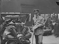 Major Barker, V.C., visiting the Canadian War Painting's Exhibition in London - He is seen with the machine in which he fought 60 German planes Fed. 1919
