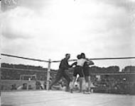 (Boxing) Lt-Col Mayes judging in Coghill (Australia) VS Journel (France) Heavyweight Fight. Inter-Allied Games, Pershing Stadium, Paris, July 1919 July, 1919.