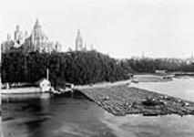 Parliament Buildings from Nepean Point showing the timber rafts on the Ottawa River [ca. 1882].