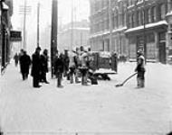 Snow removal on Sparks St. (after a storm, looking toward Metcalfe St) [ca. 1891].