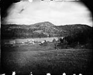 A farm opposite the mountains at the Cascades on the Gatineau River [before 1882].