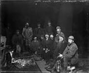 Buckskin Club at a camp fire by flashlight n.d.
