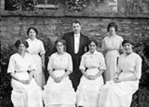 Group of waitresses with Head waiter D.W. Doody at Quinte House 1913.