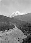 Mount Robson B.C. from tracks West of Station Showing train 1914.