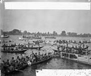 [T.R.H. The Duke and Duchess of Cornwall and York arriving at Rockcliffe in canoes manned by Indians from the Abitibi, escorted by a flotilla of boats] September 23, 1901.