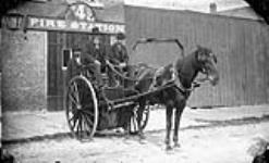 [Horse and fire reel outside Fire Station.] n.d.