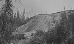Outcrop of bit. sand, Beaver R., Alta June 11, 1928