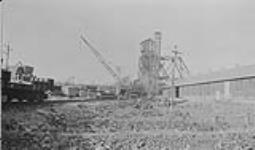 Erecting new headframe & surface buildings at Frood Mine, International Nickel Co. Copper Cliff, Ont Aug. 1928