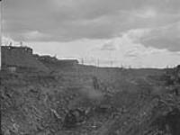 Open pit of main orebody - west end, Flin Flon, Man Sept. 2, 1930