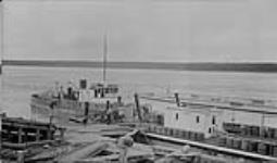 M.S. "Radium King" with barge tied up at Ft. Smith, N.W.T. Aug. 1937