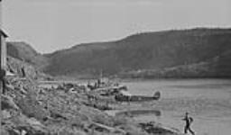 [Aircraft and shipping at the Eldorado Mine, Great Bear Lake, N.W.T. (Left to right): Bellanca 66-70 'Aircruiser' CF-AWR, M.V. "Great Bear", Fairchild 82B CF-AXN, Fairchild 51 of the R.A.C.F.] Aug. 1937