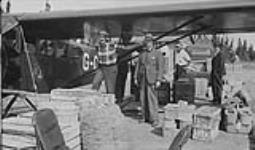 [Fairchild 71 aircraft of Canadian Airways Ltd. delivering cargo to Pickle Lake, Ont., August 1936.]