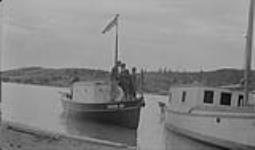 Royal Canadian Mounted Police (R.C.M.P.) boat CAMERON BAY leaving LaBine Point, Eldorado Mine, Great Bear Lake, N.W.T 1935