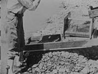 Snipers using Water wheels - Clean-up start -Quesnel River, B.C 1938
