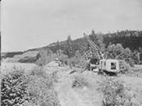 Gravel Machine operations: - General view of excavator in action, Fraser River, 5 miles North of Quesnel, B.C 1938