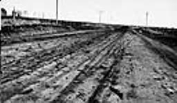 Bituminized earth road construction, Fort Trail, Alta. (Photo taken May 26th, 1924, after 24-hour rain)
