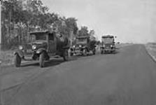 Low cost road construction in Manitoba. Final surface after rolling but before application of seal coat. 1930