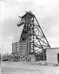 Halnor Mine. - Close-up of new steel head fram in process of being covered with metal sheeting, Porcupine, Ontario 1936