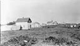 View of eastern part of Fort Chipewyan showing the Anglican Mission and Hudson Bay Post 1916