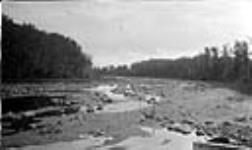 Looking downstream from Cowan Lake, Dam Gates all closed and practically no discharge, Cowan River, Sask 1919