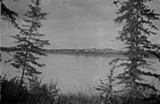 Providence Mission buildings viewed from Island in river, N.W.T 1921