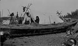 Canoe about 30' long made by the Indians of untanned moose skins sewn together with hair on the outside and stretched over roughly made frame with large willow ribs 1921
