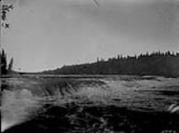 Rapids above Lady Evelyn Falls on Kakisa River, N.W.T 1921