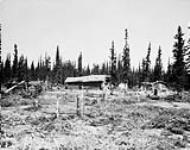 Trappers' house and dog shelters, Wholdaia Lake, N.W.T 1926